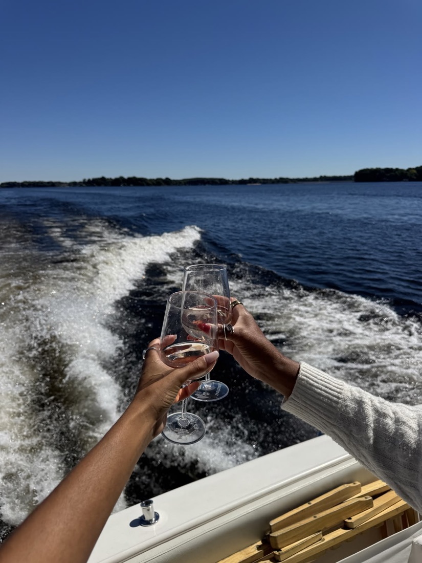 Friends raising a toast on a boat