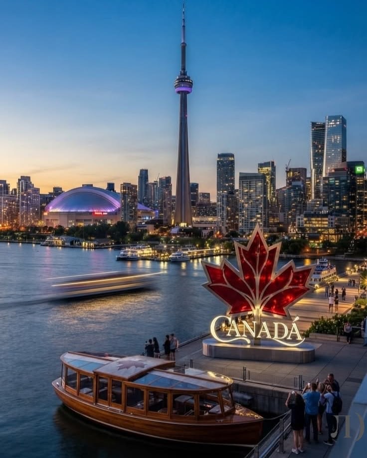 Harbourfront at dusk with the illuminated Canada sign